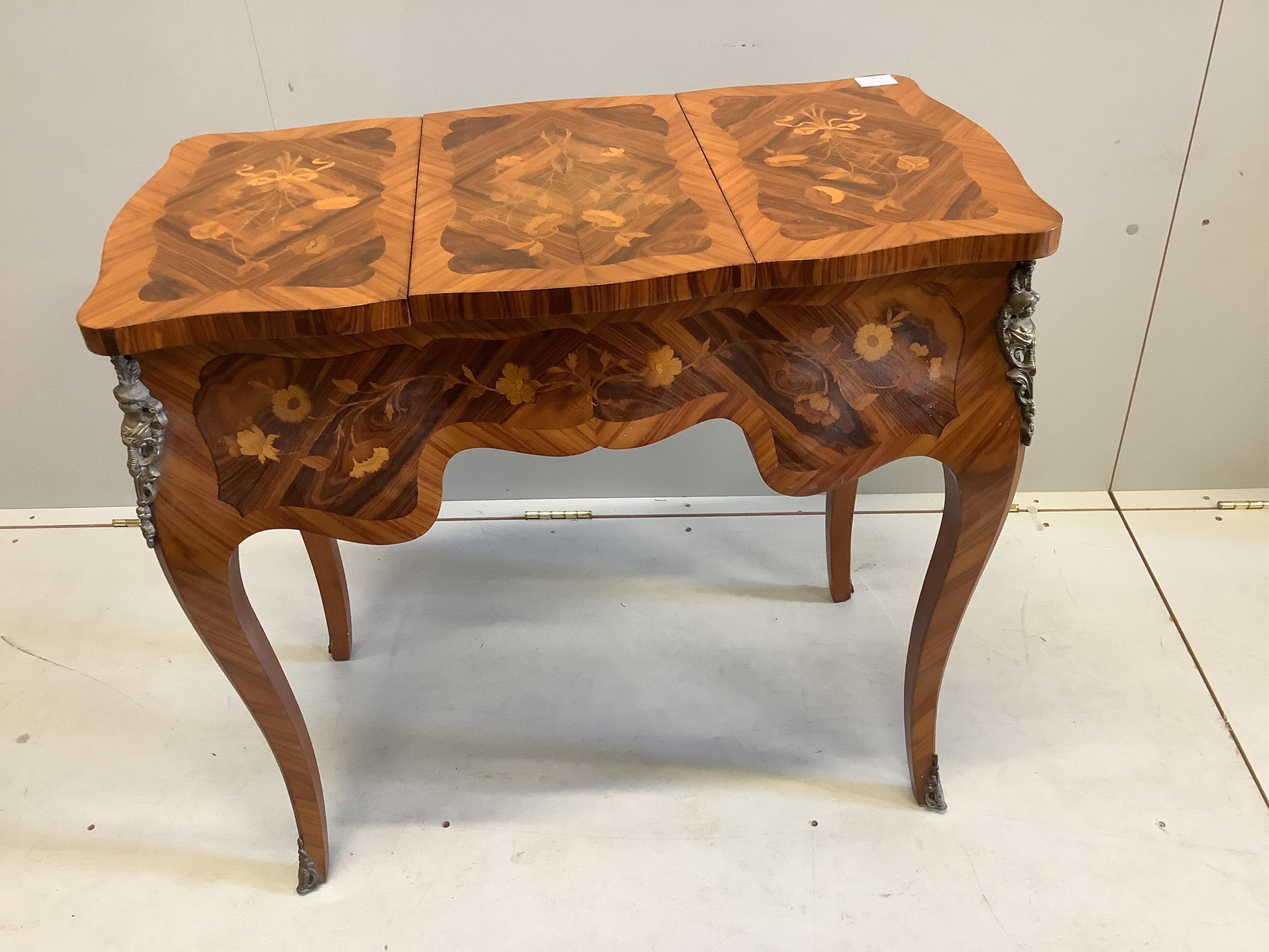 A French marquetry inlaid kingwood poudreuse, width 82cm, depth 36cm, height 74cm. Condition - good